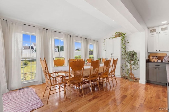 5418 Quamby Rd, Clay, NY 13041 - dining area with light wood finished floors, lofted ceiling, and recessed lighting