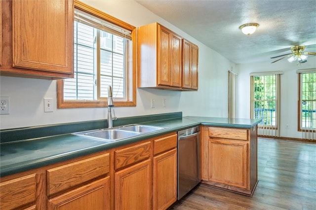 282 Troup St, Rochester, NY 14608 - kitchen with dishwasher, a peninsula, dark wood-type flooring, ceiling fan, and dark countertops