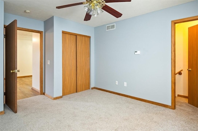 282 Troup St, Rochester, NY 14608 - unfurnished bedroom featuring carpet, a closet, and a ceiling fan