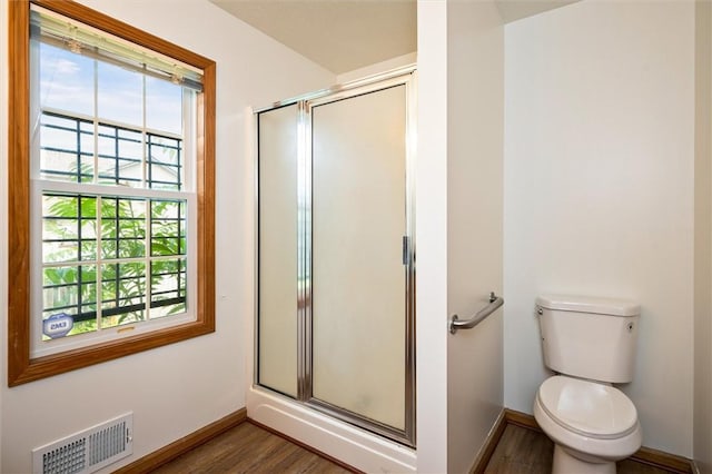 282 Troup St, Rochester, NY 14608 - bathroom with a shower stall and wood finished floors