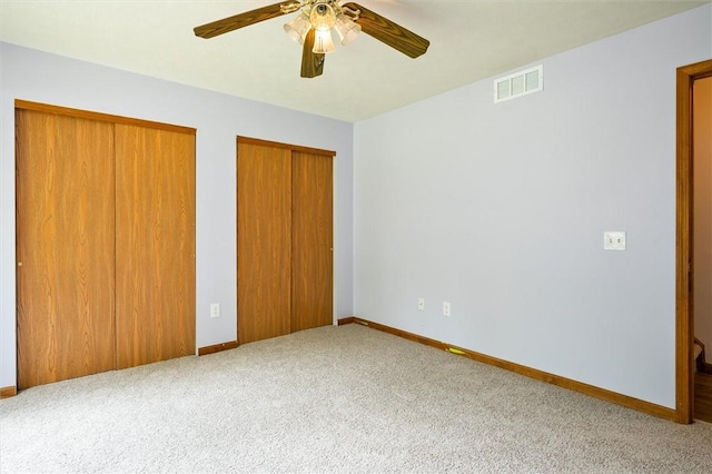 282 Troup St, Rochester, NY 14608 - unfurnished bedroom with carpet flooring, multiple closets, and ceiling fan