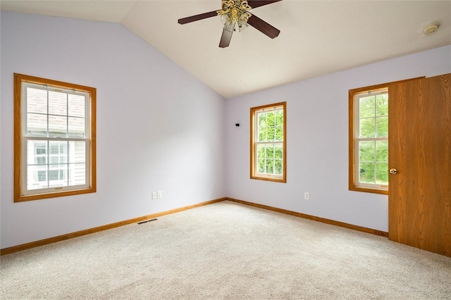 282 Troup St, Rochester, NY 14608 - empty room with light colored carpet, plenty of natural light, a smoke detector, and lofted ceiling