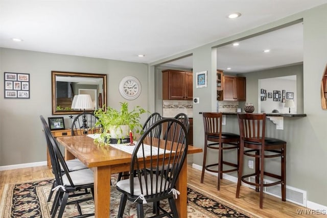 68 Dover Dr, West Seneca, NY 14224 - dining room featuring light wood-type flooring and recessed lighting