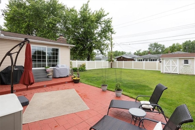 68 Dover Dr, West Seneca, NY 14224 - fenced backyard featuring a patio area, grilling area, and a storage unit