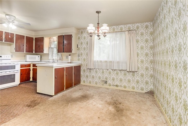 2622 Nichols St, Ogden, NY 14559 - kitchen featuring white appliances, wallpapered walls, light countertops, a ceiling fan, and a chandelier