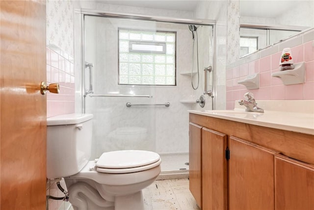 2622 Nichols St, Ogden, NY 14559 - full bathroom featuring vanity, a stall shower, and tile walls