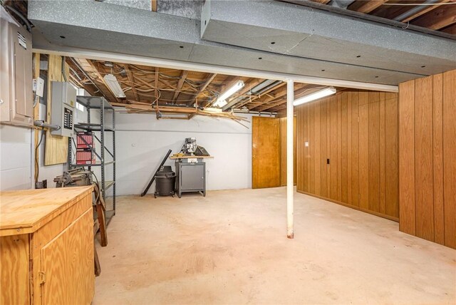 2622 Nichols St, Ogden, NY 14559 - unfinished below grade area featuring electric panel and wooden walls