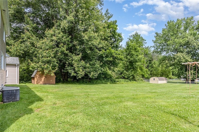 2622 Nichols St, Ogden, NY 14559 - view of grassy yard with a storage unit
