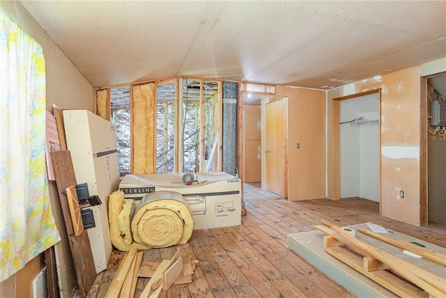 2622 Nichols St, Ogden, NY 14559 - hallway featuring light wood-style flooring and a heating unit