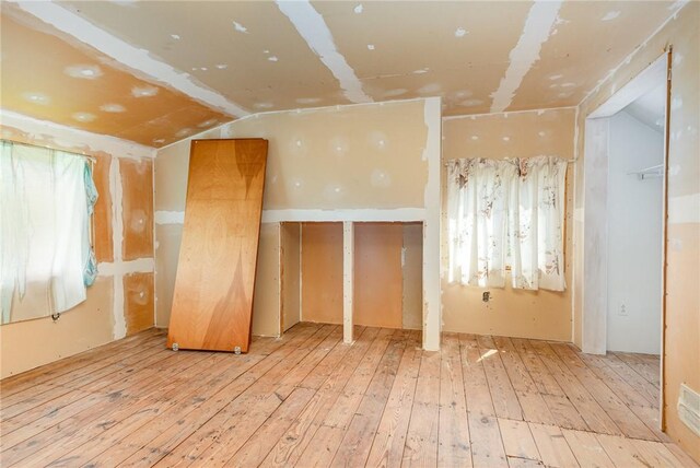 2622 Nichols St, Ogden, NY 14559 - empty room featuring hardwood / wood-style floors and lofted ceiling