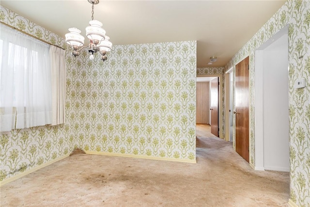 2622 Nichols St, Ogden, NY 14559 - empty room featuring wallpapered walls, a chandelier, and carpet
