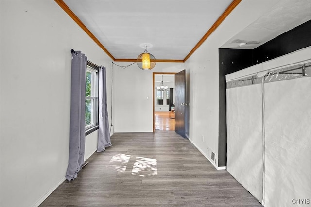 119 Kenneth Ave, Onondaga, NY 13120 - corridor featuring a chandelier, ornamental molding, and wood finished floors