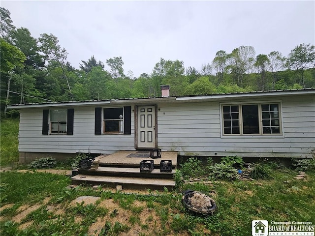 20 N Main St, Bolivar, NY 14715 - rear view of house featuring a chimney