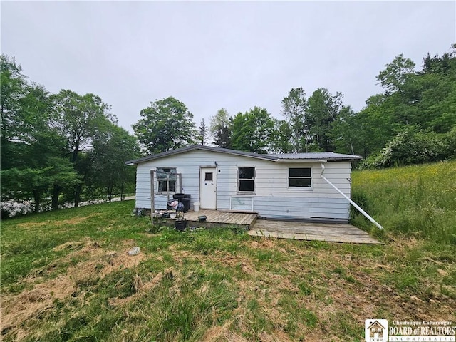 20 N Main St, Bolivar, NY 14715 - rear view of house with a deck and a metal roof
