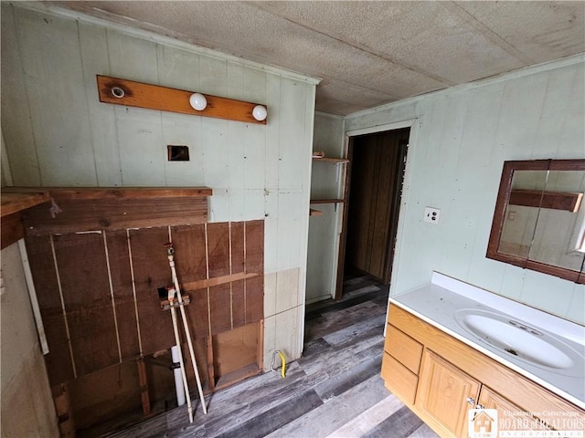 20 N Main St, Bolivar, NY 14715 - bathroom with wood finished floors, vanity, and wood walls