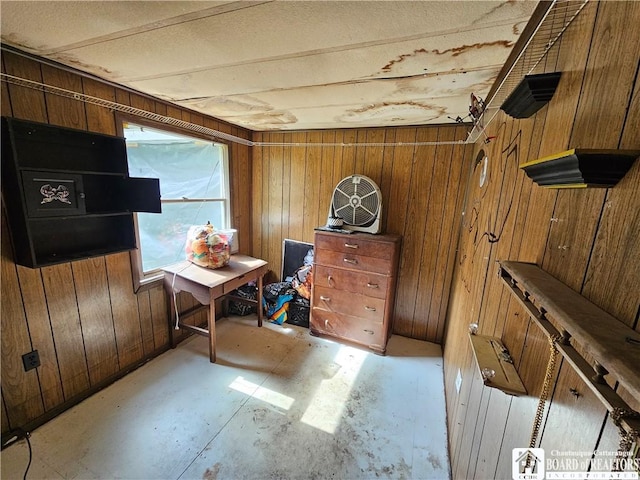 20 N Main St, Bolivar, NY 14715 - bedroom featuring wood walls and unfinished concrete floors