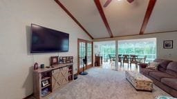 11 Overbrook Rd, Erwin, NY 14870 - carpeted living room with a ceiling fan and a wall of windows