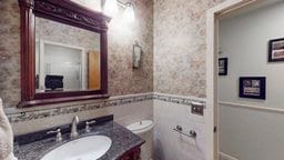11 Overbrook Rd, Erwin, NY 14870 - bathroom featuring vanity, wallpapered walls, and wainscoting