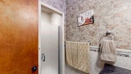 11 Overbrook Rd, Erwin, NY 14870 - full bathroom with wallpapered walls and a shower with door