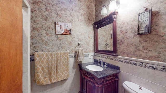 11 Overbrook Rd, Erwin, NY 14870 - bathroom featuring wallpapered walls, vanity, wainscoting, and tile walls