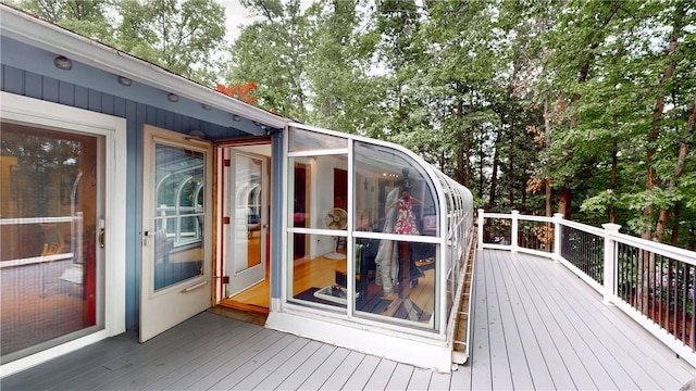 11 Overbrook Rd, Erwin, NY 14870 - deck with a sunroom and view of wooded area