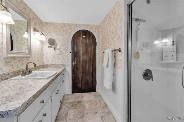 2846 Amsdell Rd, Hamburg, NY 14075 - full bathroom with vanity, a shower stall, and wallpapered walls