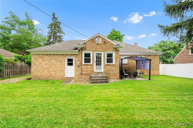 34 Wainwright Rd, Cheektowaga, NY 14215 - rear view of house featuring a gazebo, a fenced backyard, brick siding, and a patio area