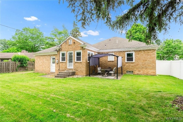 34 Wainwright Rd, Cheektowaga, NY 14215 - back of house featuring a fenced backyard, brick siding, and a patio