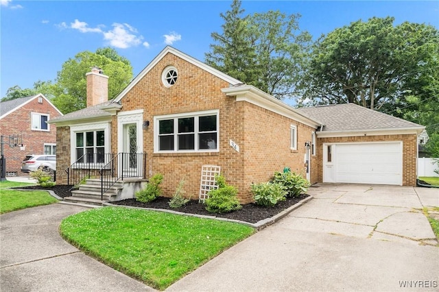 34 Wainwright Rd, Cheektowaga, NY 14215 - view of front of property with concrete driveway, brick siding, a chimney, and an attached garage