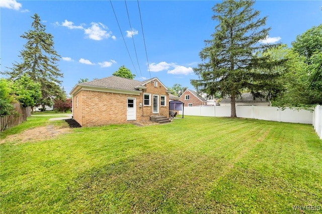 34 Wainwright Rd, Cheektowaga, NY 14215 - back of house featuring brick siding and a fenced backyard