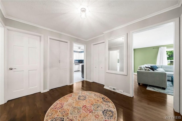 34 Wainwright Rd, Cheektowaga, NY 14215 - entrance foyer featuring dark wood-style flooring, ornamental molding, and a textured ceiling
