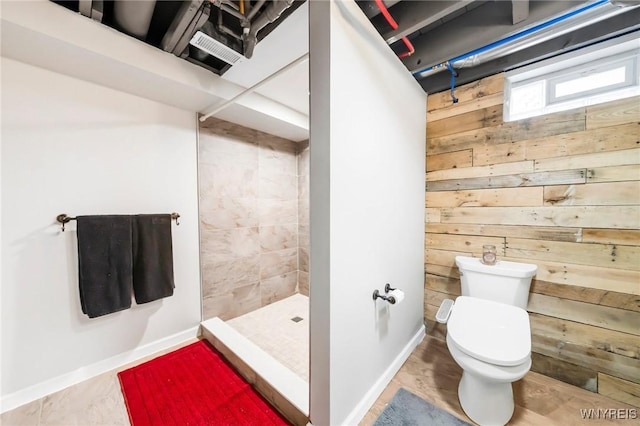 34 Wainwright Rd, Cheektowaga, NY 14215 - bathroom featuring a stall shower and wood walls
