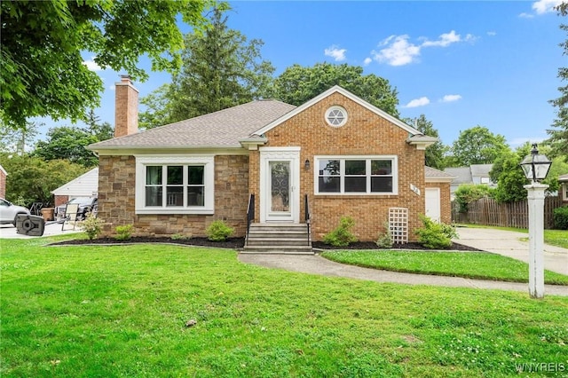 34 Wainwright Rd, Cheektowaga, NY 14215 - bungalow-style home with a chimney, entry steps, concrete driveway, stone siding, and brick siding