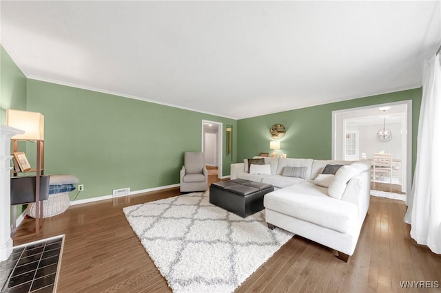 34 Wainwright Rd, Cheektowaga, NY 14215 - living room featuring wood finished floors and crown molding