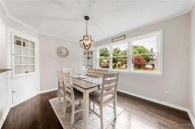 34 Wainwright Rd, Cheektowaga, NY 14215 - dining room with dark wood-style flooring, crown molding, and a chandelier