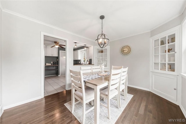 34 Wainwright Rd, Cheektowaga, NY 14215 - dining room featuring a chandelier, a ceiling fan, crown molding, and dark wood finished floors