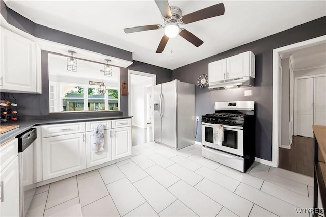 34 Wainwright Rd, Cheektowaga, NY 14215 - kitchen with stainless steel appliances, under cabinet range hood, white cabinetry, dark countertops, and ceiling fan