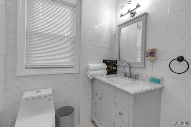 549 15th St, Niagara Falls, NY 14301 - bathroom featuring tile walls and vanity