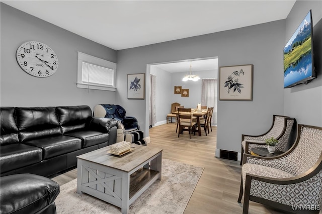 549 15th St, Niagara Falls, NY 14301 - living area featuring a chandelier and light wood-style floors