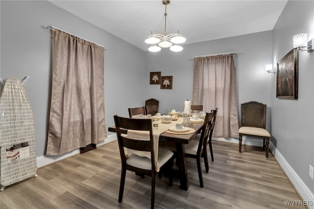549 15th St, Niagara Falls, NY 14301 - dining area featuring a chandelier and wood finished floors