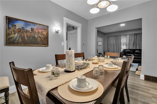 549 15th St, Niagara Falls, NY 14301 - dining space featuring wood finished floors and a chandelier