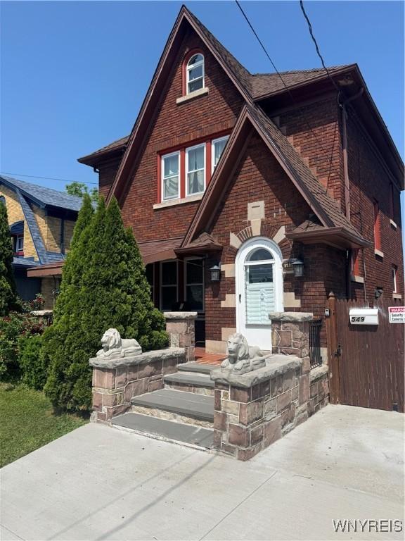549 15th St, Niagara Falls, NY 14301 - tudor-style house with brick siding