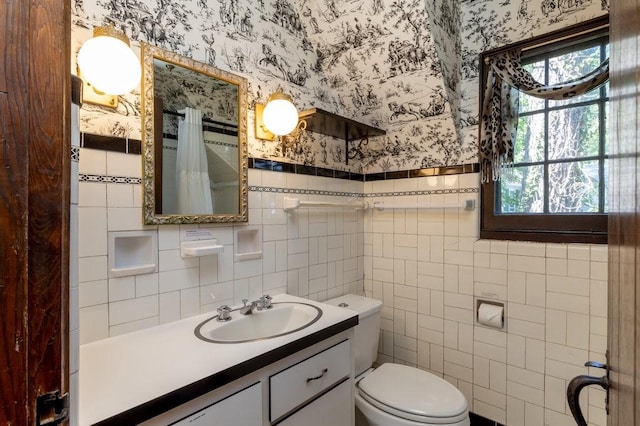 320 Glen Ave, Elmira, NY 14905 - full bathroom with wallpapered walls, tile walls, plenty of natural light, vanity, and a shower with shower curtain
