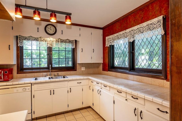 320 Glen Ave, Elmira, NY 14905 - kitchen with dishwasher, white cabinets, tasteful backsplash, light tile patterned flooring, and light countertops