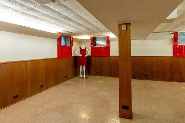 320 Glen Ave, Elmira, NY 14905 - finished below grade area featuring wooden walls, wainscoting, and tile patterned floors