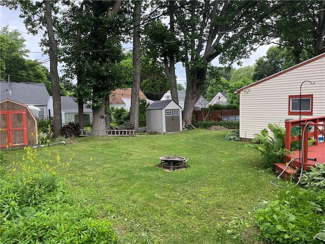 56 Canasta Rd, Greece, NY 14615 - view of yard with a storage unit, an outdoor fire pit, and a deck