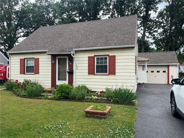 56 Canasta Rd, Greece, NY 14615 - view of front of property featuring roof with shingles, driveway, a front yard, and a garage