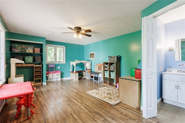 387 Brandon Rd, Irondequoit, NY 14622 - home office featuring ceiling fan, wood finished floors, and a textured ceiling