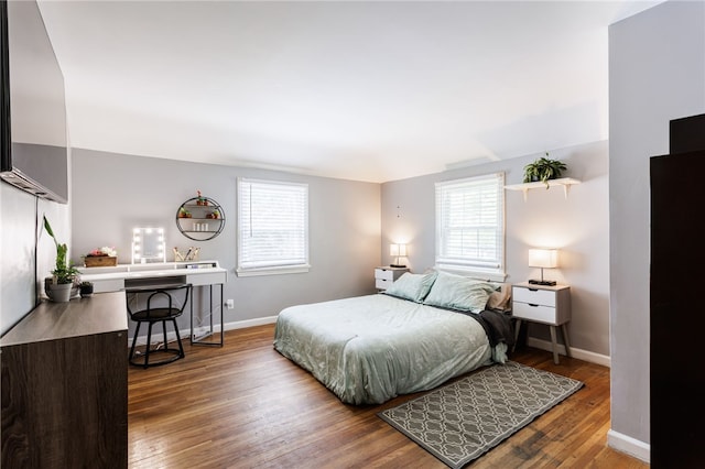 387 Brandon Rd, Irondequoit, NY 14622 - bedroom with multiple windows and wood finished floors