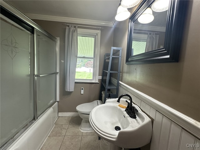 504 Allen Rd, Clay, NY 13212 - full bath with combined bath / shower with glass door, ornamental molding, tile patterned flooring, and wainscoting